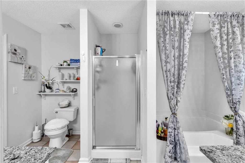 12 Ranger Road Southeast Cartersville, GA 30121 - Photo 26 of 51 a bathroom with a toilet and a shower