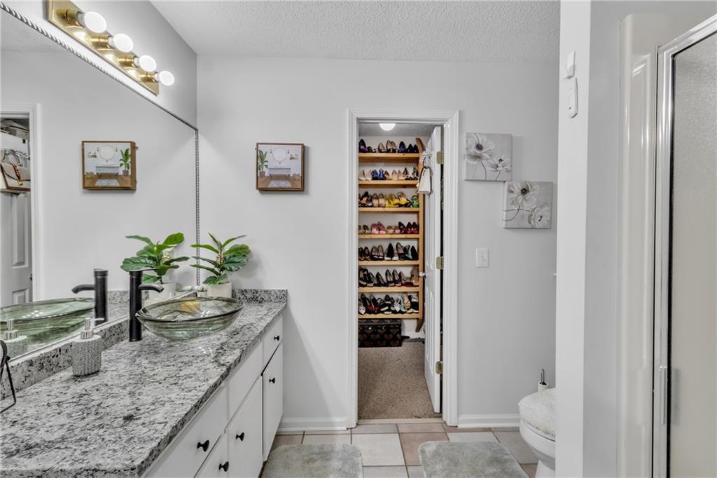 12 Ranger Road Southeast Cartersville, GA 30121 - Photo 28 of 51 a kitchen with granite countertop a refrigerator and a sink