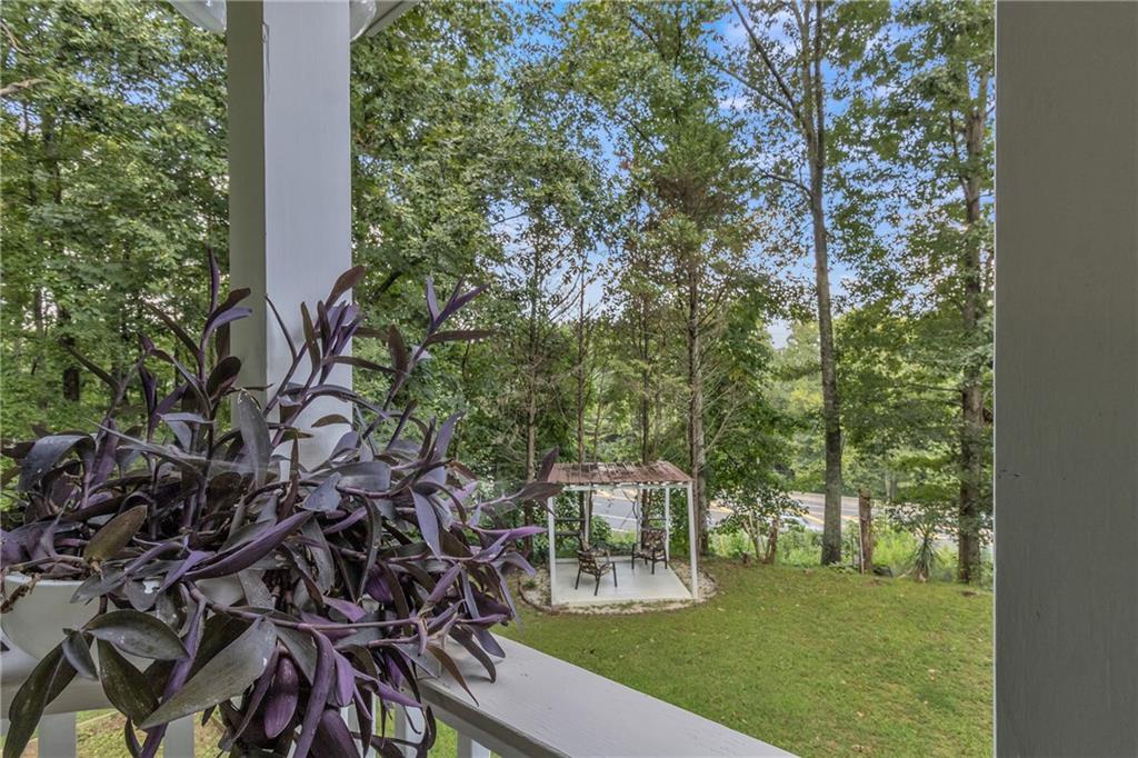 12 Ranger Road Southeast Cartersville, GA 30121 - Photo 31 of 51 a view of a backyard with lawn chairs with plants