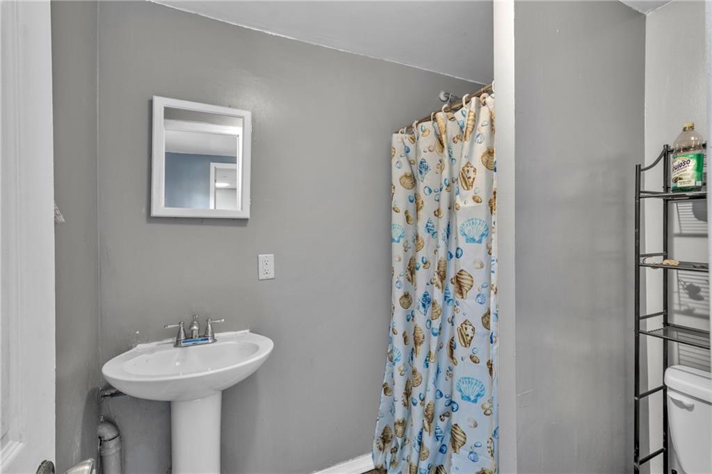 12 Ranger Road Southeast Cartersville, GA 30121 - Photo 38 of 51 a bathroom with a sink and a mirror