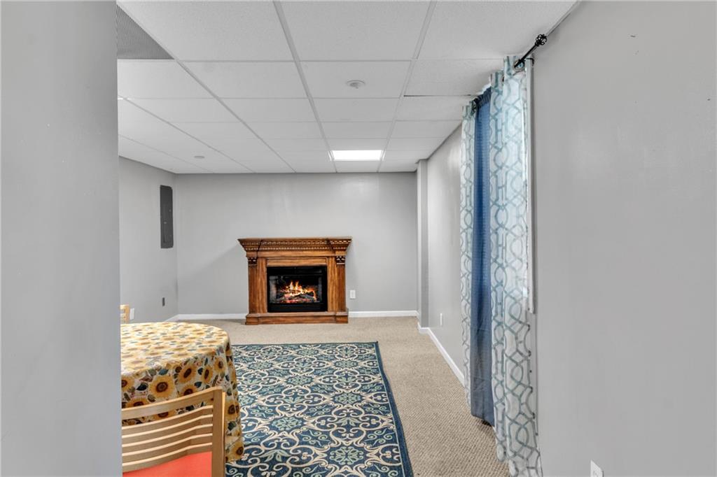 12 Ranger Road Southeast Cartersville, GA 30121 - Photo 42 of 51 a view of an empty room with a fireplace and a window