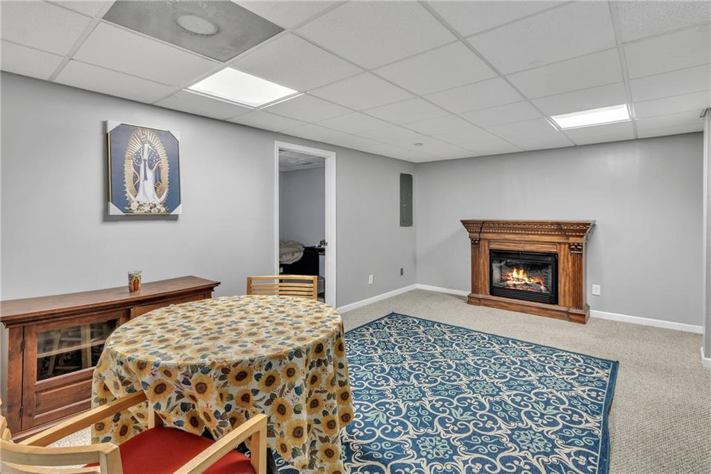 12 Ranger Road Southeast Cartersville, GA 30121 - Photo 43 of 51 a bedroom with a bed and a fireplace