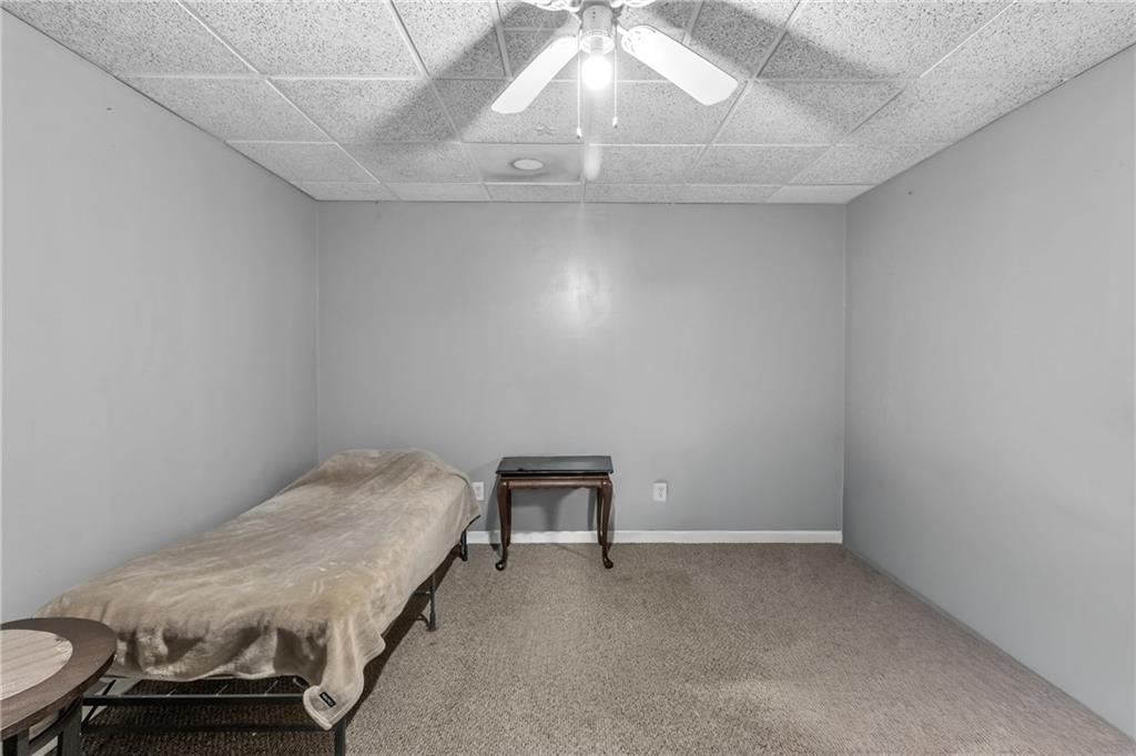 12 Ranger Road Southeast Cartersville, GA 30121 - Photo 45 of 51 a room with a bed and chandelier