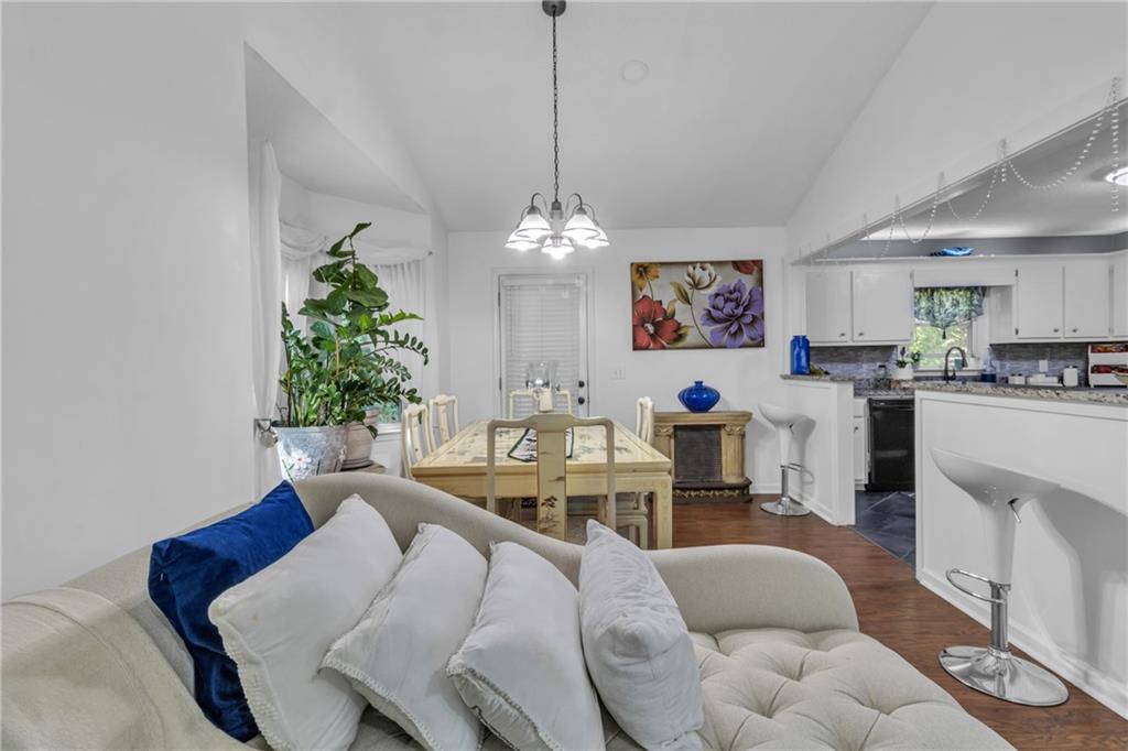 12 Ranger Road Southeast Cartersville, GA 30121 - Photo 10 of 51 a living room with furniture a chandelier and a table