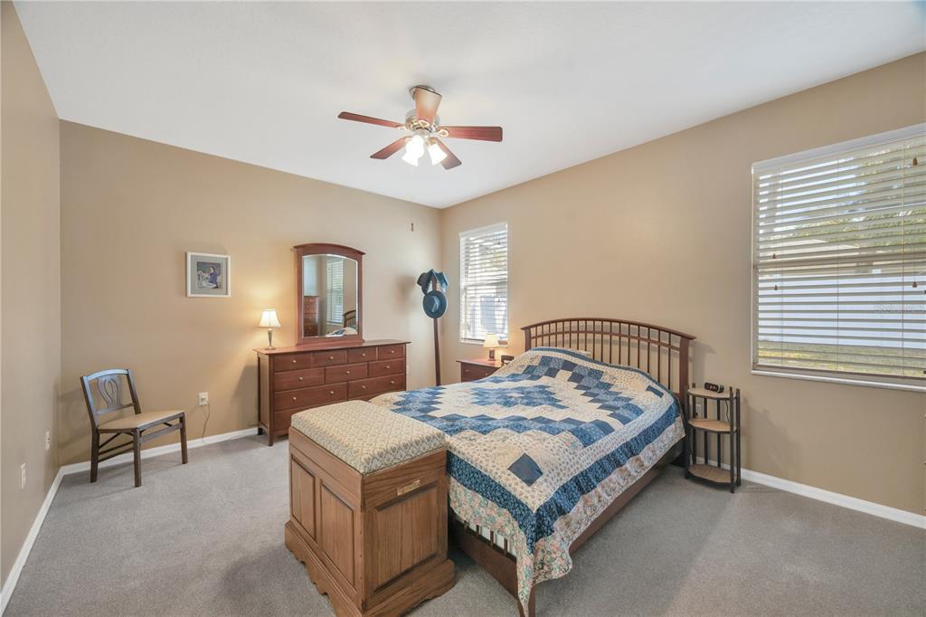 17115 Falconridge Road Lithia, FL 33547 - Photo 14 of 33 a living room with a bed furniture and a window
