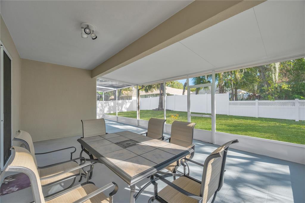 17115 Falconridge Road Lithia, FL 33547 - Photo 25 of 33 a view of a dining room with furniture window and outside view