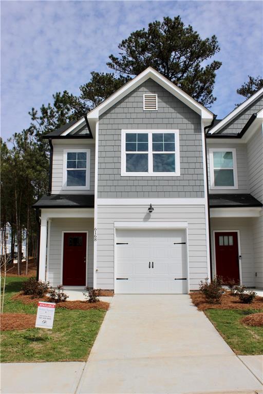 6168 Redan Overlook, Unit 90 Lithonia, GA 30058 - Photo 1 of 1 a front view of a house with garden and parking