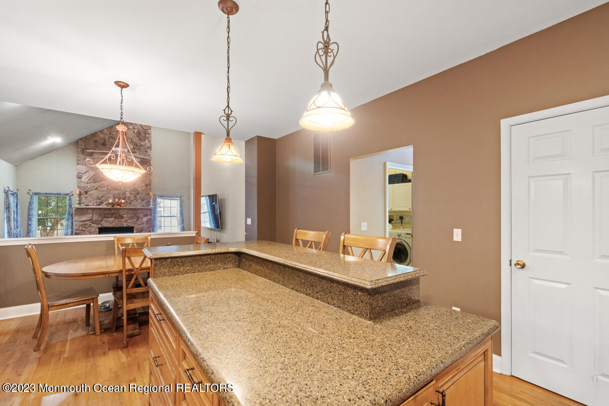 6 Forest View Drive Bayville, NJ 08721 - Photo 24 of 39 a living room with furniture and a chandelier
