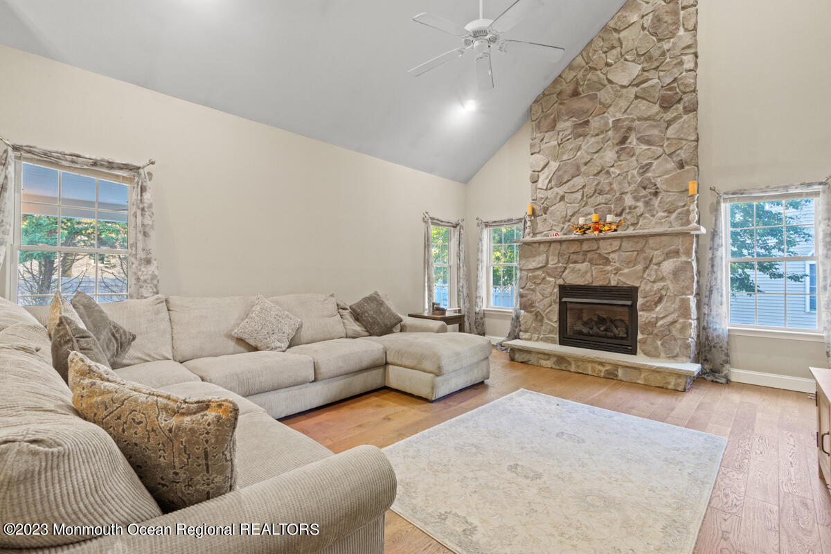 6 Forest View Drive Bayville, NJ 08721 - Photo 5 of 39 a living room with furniture and a fireplace