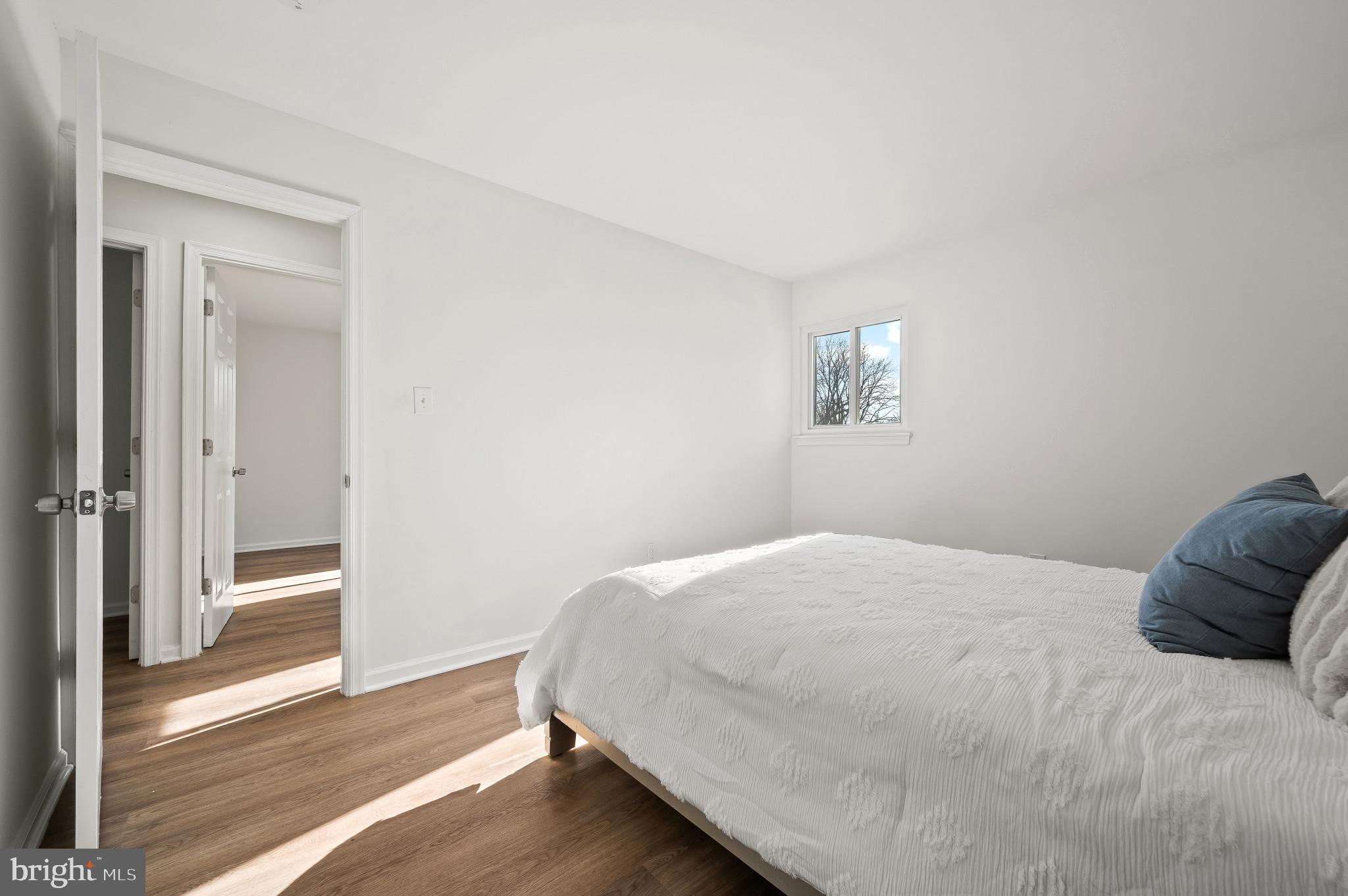 200 Timber Grove Road Reisterstown, MD 21136 - Photo 16 of 30 a bedroom with a bed and wooden floor