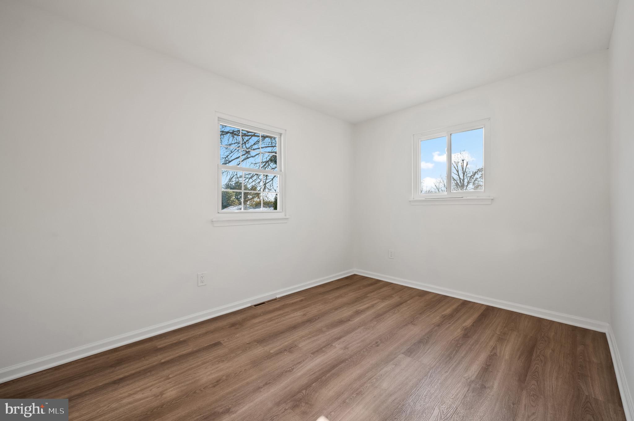 200 Timber Grove Road Reisterstown, MD 21136 - Photo 17 of 30 wooden floor in an empty room with a window