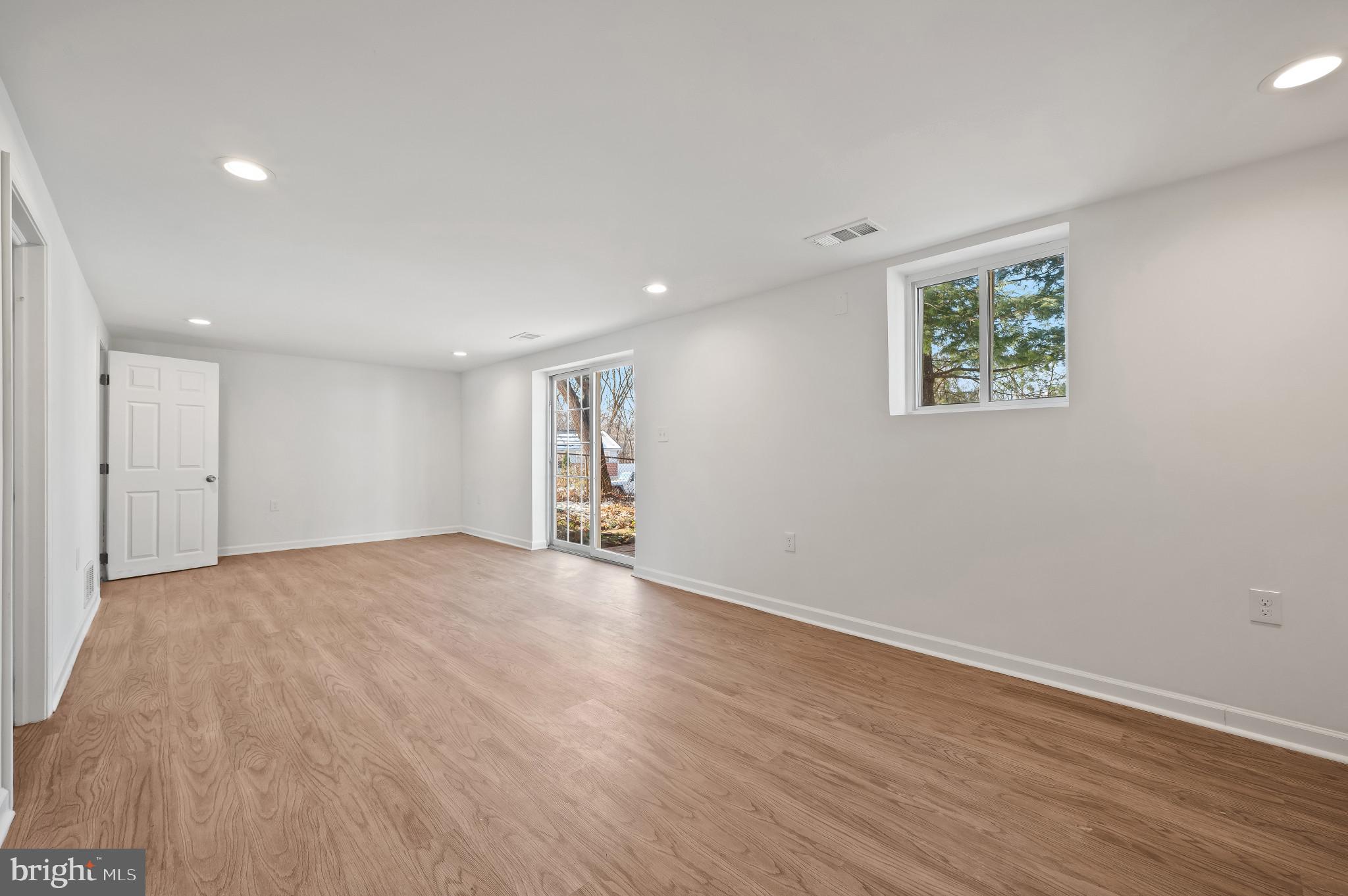 200 Timber Grove Road Reisterstown, MD 21136 - Photo 18 of 30 a view of an empty room with wooden floor and a window