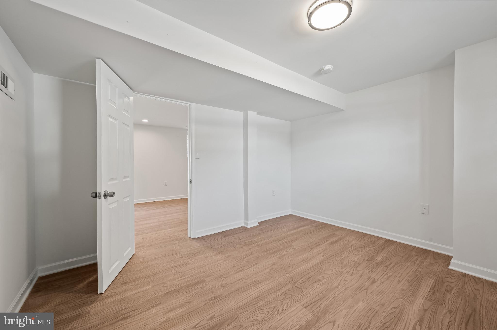 200 Timber Grove Road Reisterstown, MD 21136 - Photo 21 of 30 a view of an empty room with wooden floor