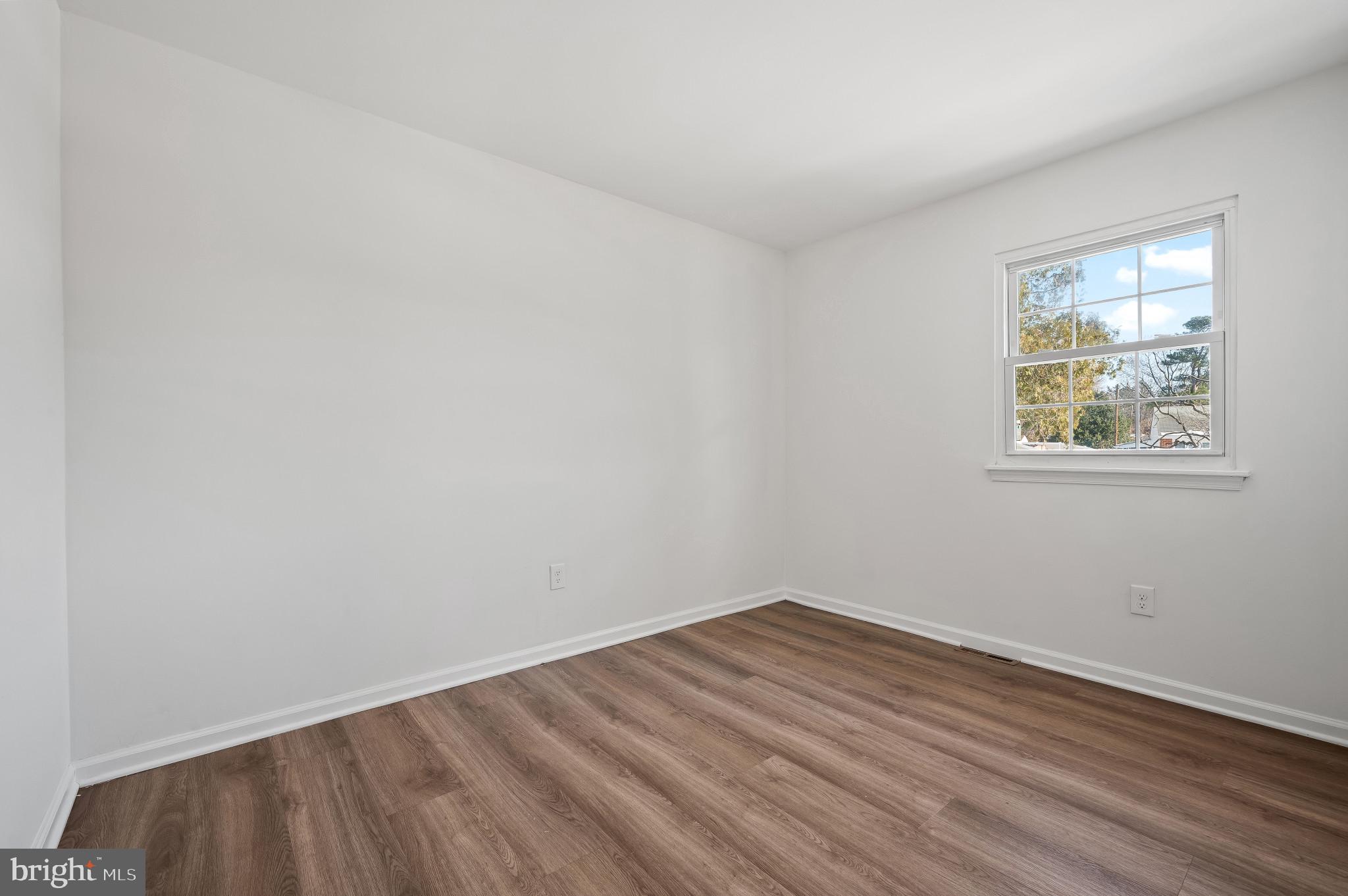 200 Timber Grove Road Reisterstown, MD 21136 - Photo 22 of 30 wooden floor in an empty room with a window
