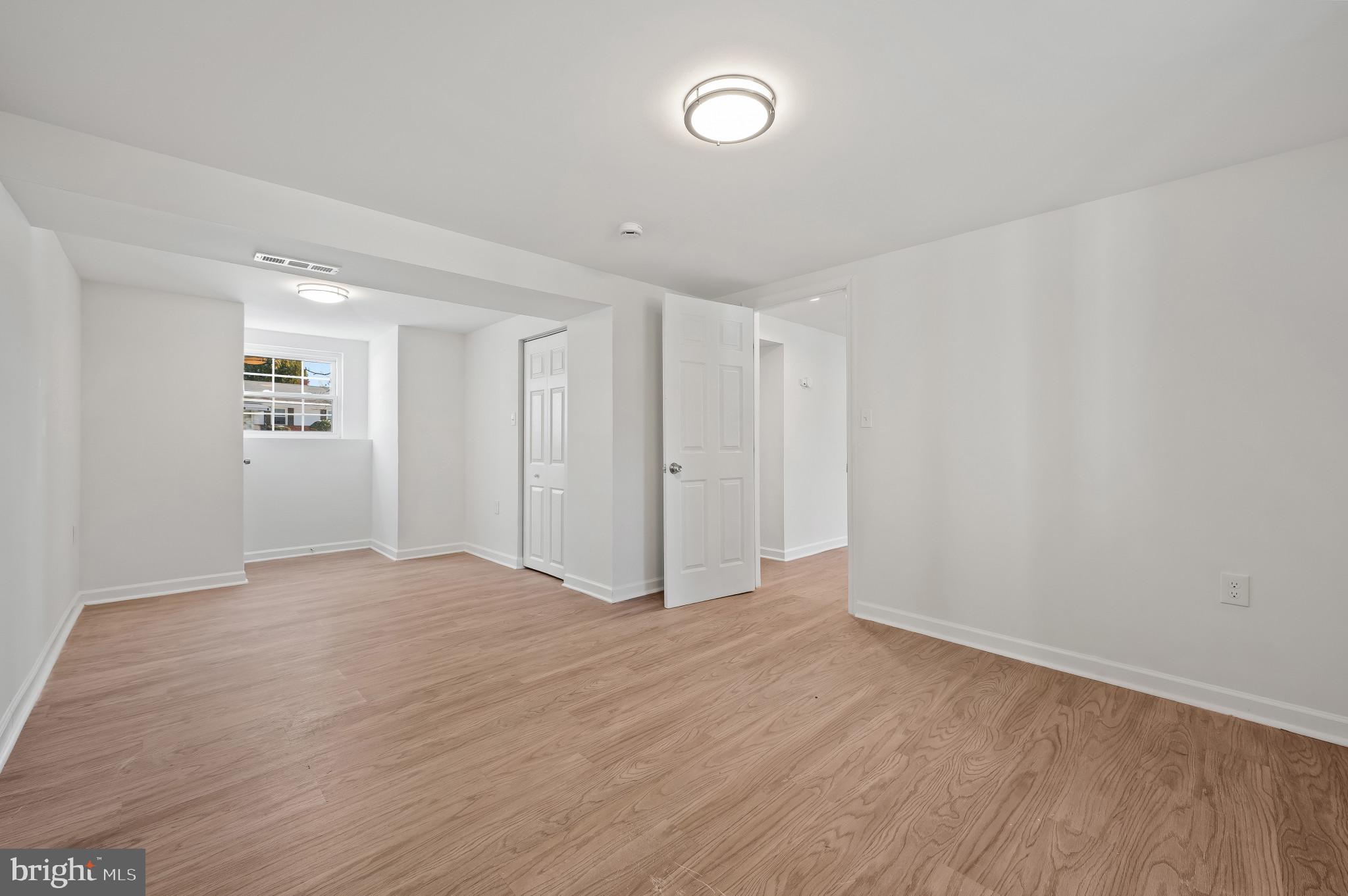 200 Timber Grove Road Reisterstown, MD 21136 - Photo 23 of 30 a view of an empty room with wooden floor and closet
