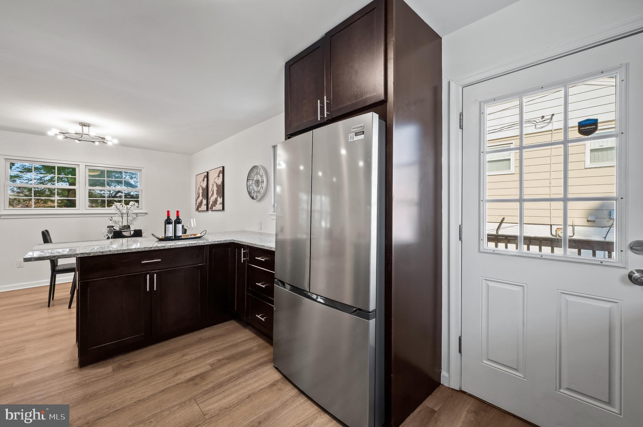 200 Timber Grove Road Reisterstown, MD 21136 - Photo 5 of 30 a kitchen with stainless steel appliances granite countertop a refrigerator and a sink