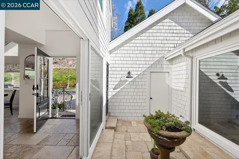 a view of entryway and hall with dining room