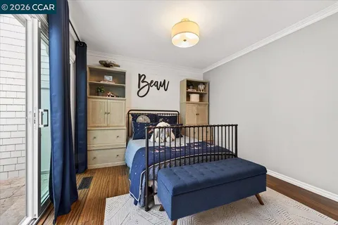 a view of a hallway with entryway wooden floor and front door
