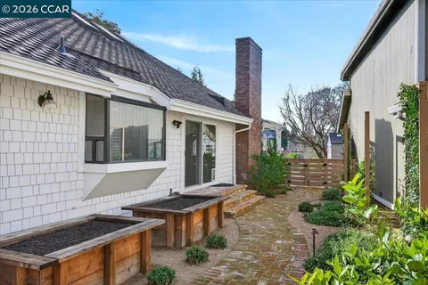 a outdoor space with lots of furniture and a fireplace