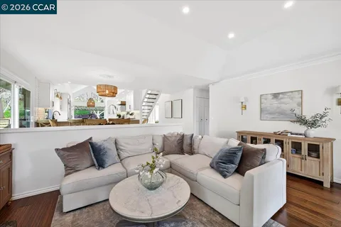 a living room with furniture and a table