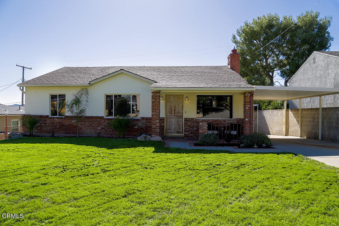 a house view with a garden space