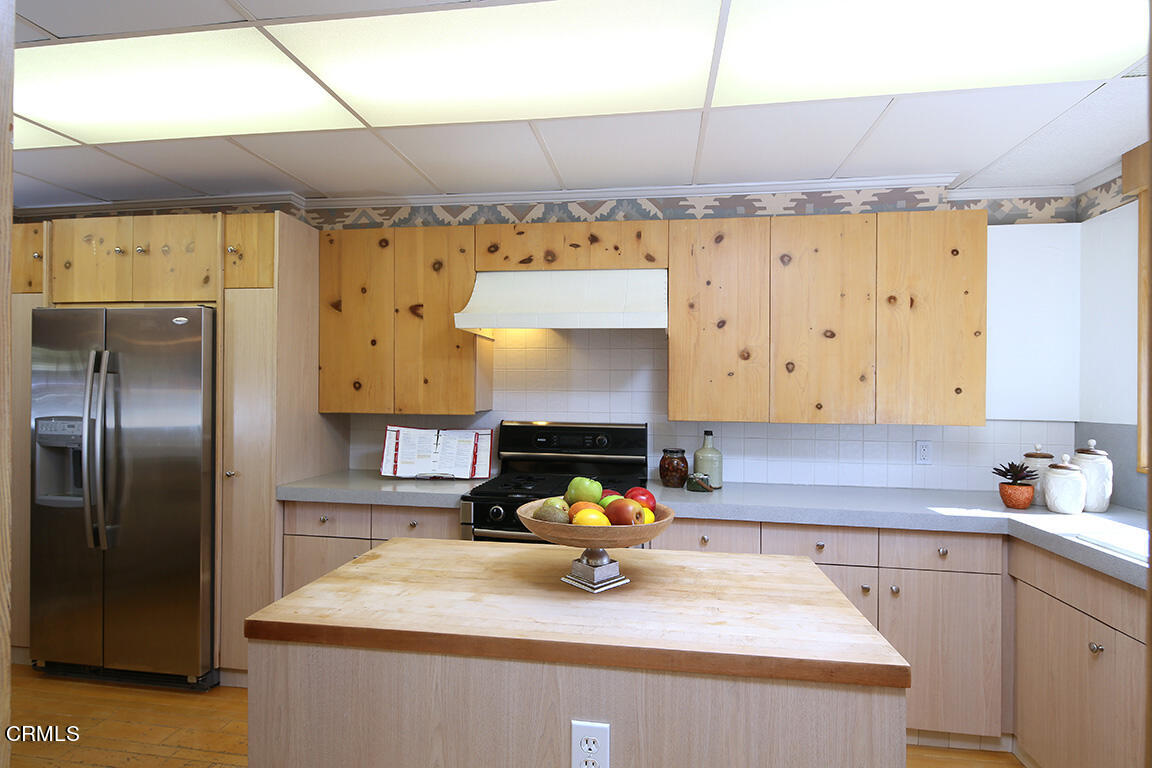 3330 Paraiso Way Glendale, CA 91214 - Photo 12 of 32 a kitchen with granite countertop a sink stainless steel appliances and cabinets