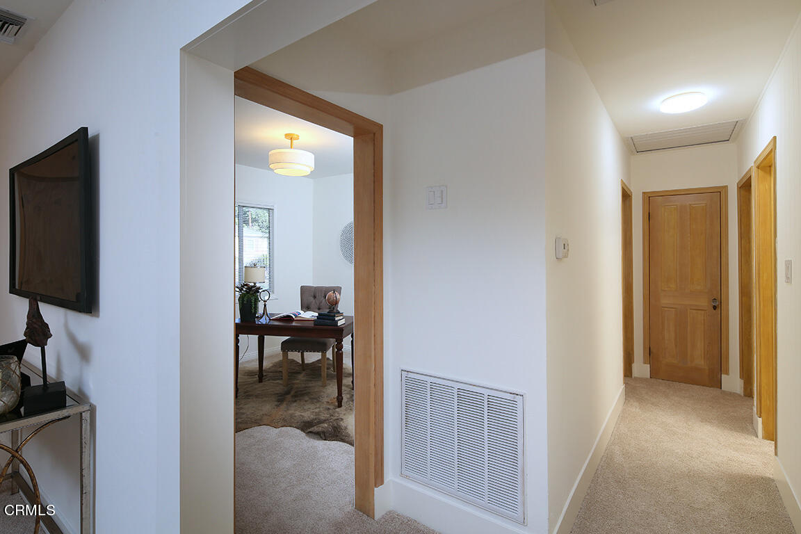 3330 Paraiso Way Glendale, CA 91214 - Photo 14 of 32 a view of a hallway with living room and furniture