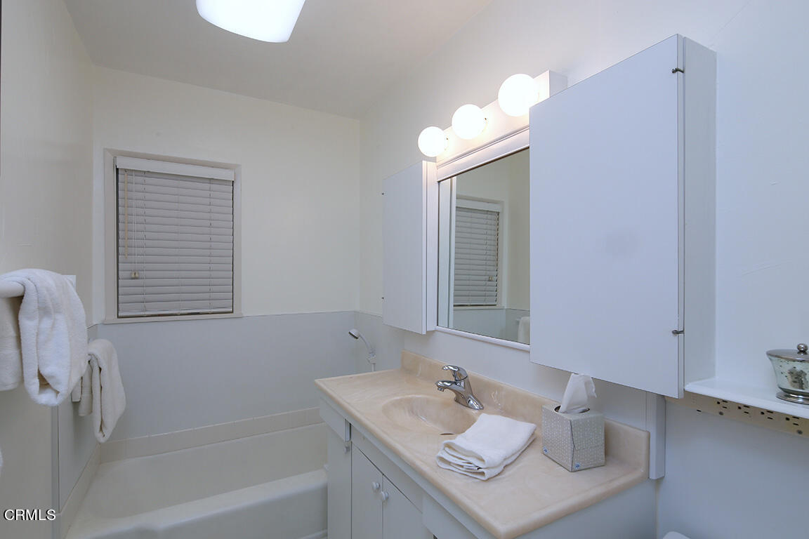 3330 Paraiso Way Glendale, CA 91214 - Photo 16 of 32 a bathroom with a sink vanity tub and a mirror