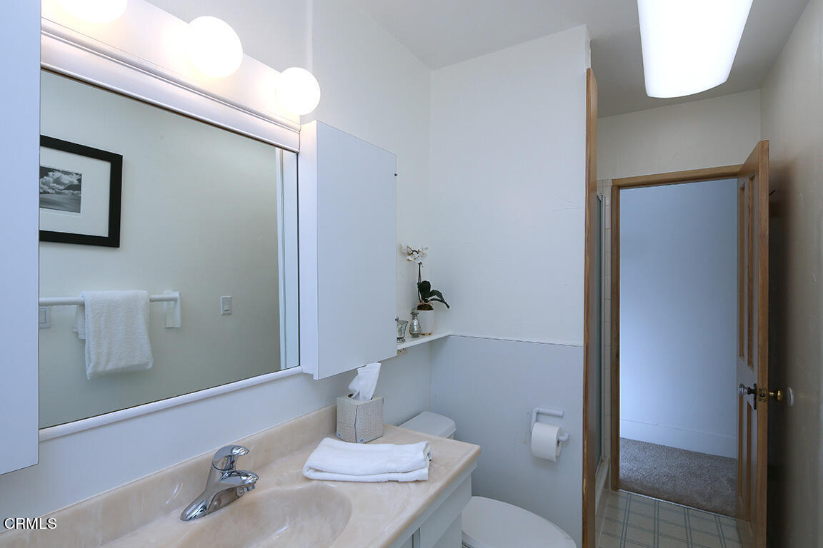3330 Paraiso Way Glendale, CA 91214 - Photo 17 of 32 a bathroom with a sink and a mirror
