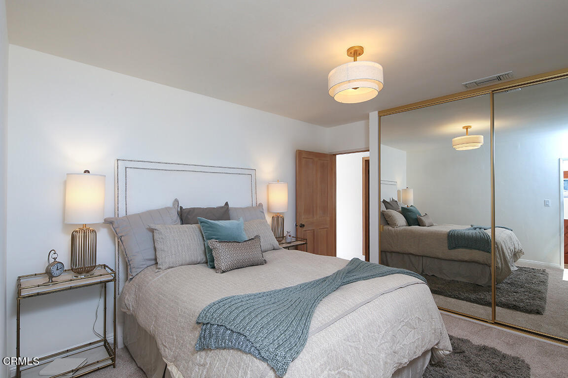 3330 Paraiso Way Glendale, CA 91214 - Photo 20 of 32 a bedroom with a bed and a chandelier