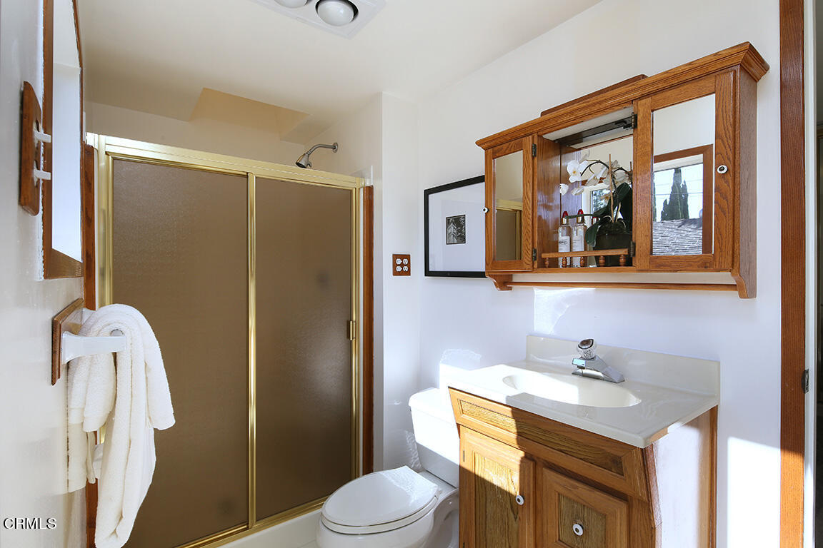 3330 Paraiso Way Glendale, CA 91214 - Photo 21 of 32 a bathroom with a sink vanity mirror and toilet