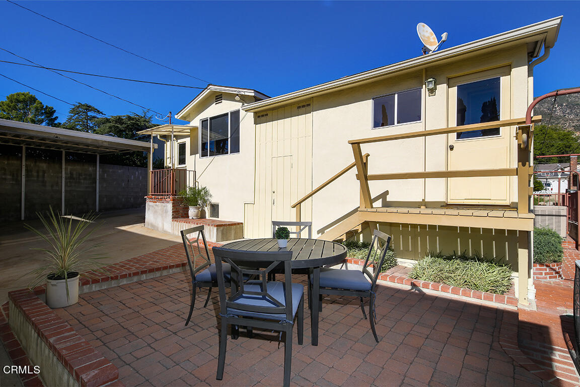 3330 Paraiso Way Glendale, CA 91214 - Photo 23 of 32 a view of a patio with table and chairs with wooden floor and fence
