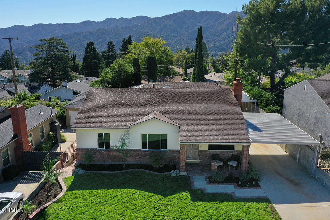 3330 Paraiso Way Glendale, CA 91214 - Photo 28 of 32 a aerial view of a house with a yard table and chairs