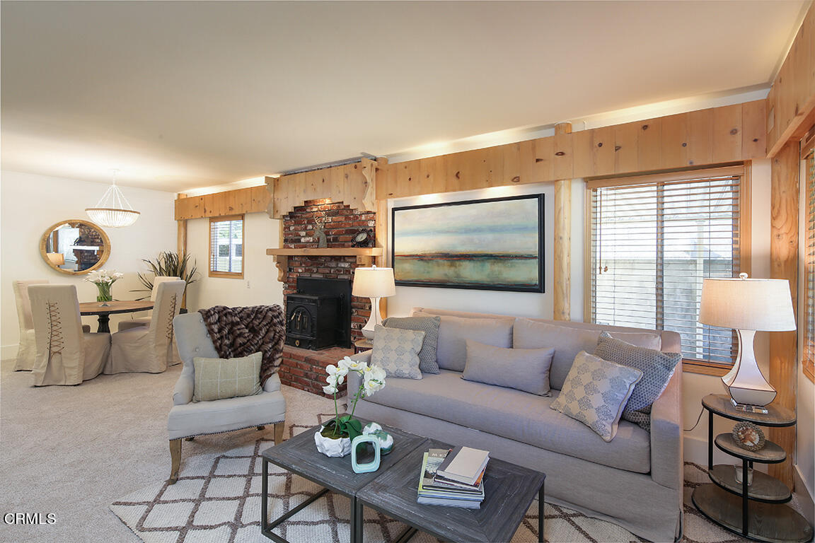 3330 Paraiso Way Glendale, CA 91214 - Photo 3 of 32 a living room with furniture a rug and a flat screen tv
