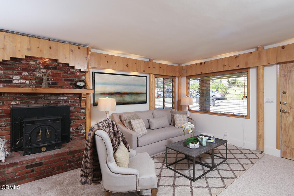 3330 Paraiso Way Glendale, CA 91214 - Photo 4 of 32 a living room with furniture a flat screen tv and a fireplace
