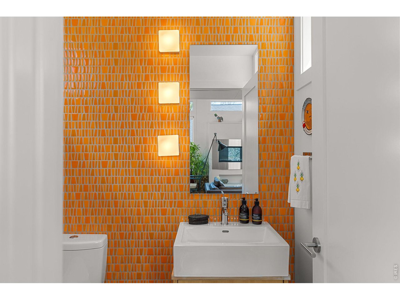 3123 3rd Street Boulder, CO 80304 - Photo 22 of 50 a bathroom with a sink a mirror and a shower