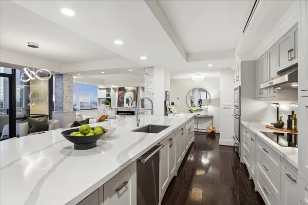 a living room with furniture and a mirror