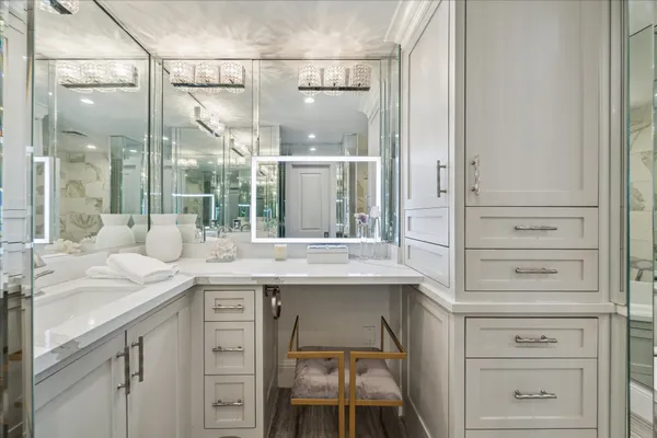 a bedroom with a bed a couch and dresser