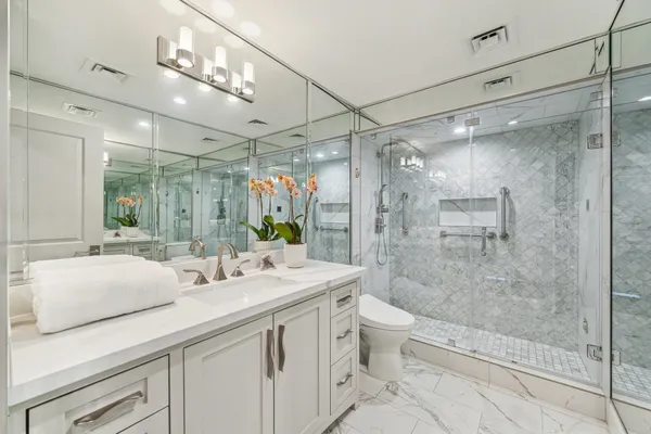 a living room with furniture a rug and a large window