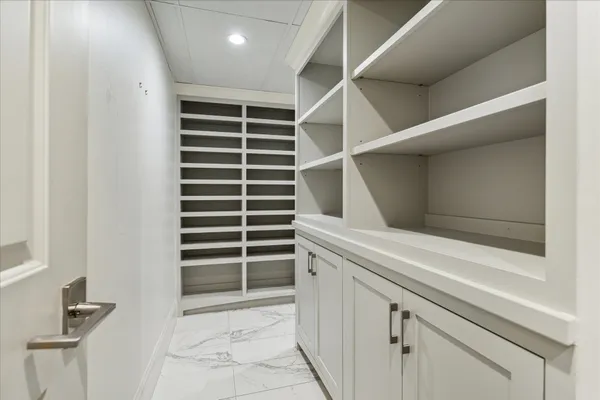 a bathroom with a double vanity sink toilet and shower