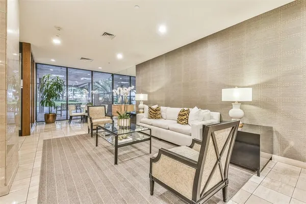 a large room with wooden floor and furniture