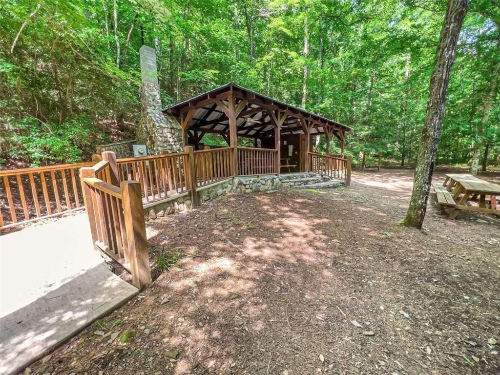 0 Trout Line Court Talking Rock, GA 30175 - Photo 35 of 50 a view of a small yard with wooden fence and large trees