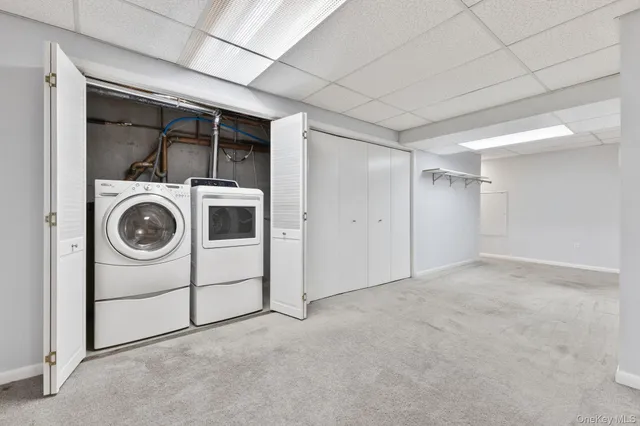 a view of a storage & utility room with washer and dryer