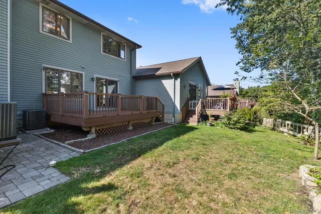 a view of backyard with a garden and entertaining space