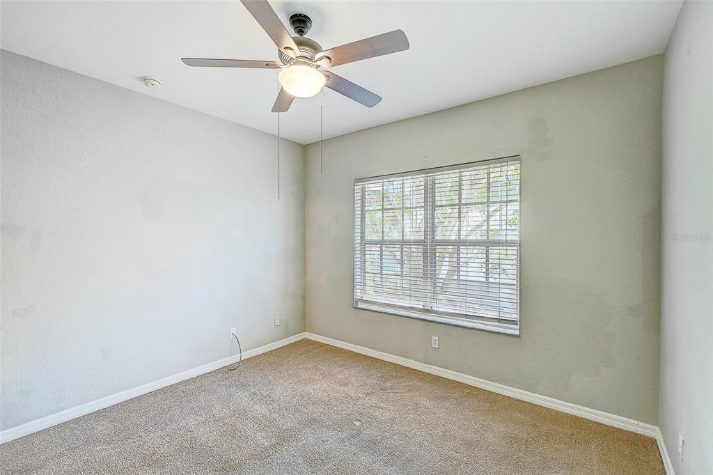 8358 Bernwood Cove Loop, Unit 708 Fort Myers, FL 33966 - Photo 17 of 32 an empty room with a window