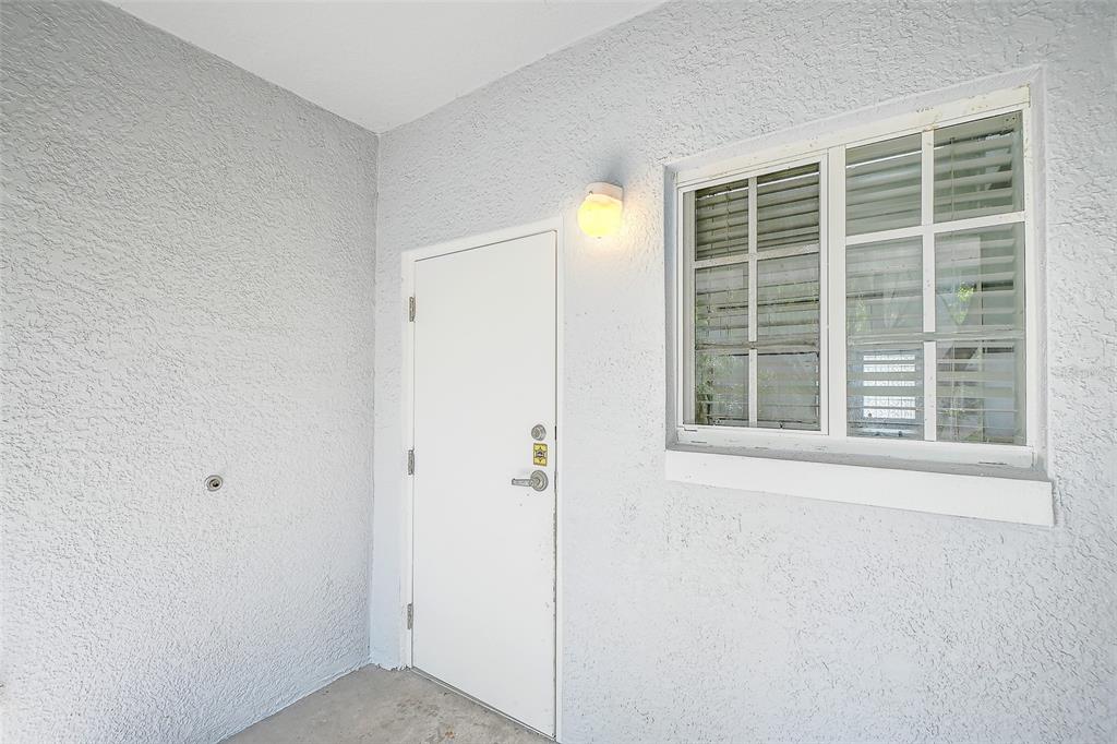 8358 Bernwood Cove Loop, Unit 708 Fort Myers, FL 33966 - Photo 28 of 32 a view of an empty room with a window