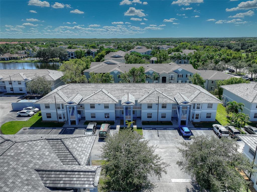 8358 Bernwood Cove Loop, Unit 708 Fort Myers, FL 33966 - Photo 5 of 32 an aerial view of a house with yard swimming pool and outdoor seating