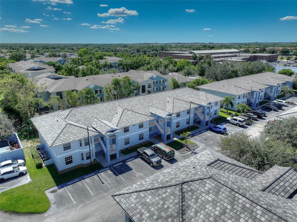 8358 Bernwood Cove Loop, Unit 708 Fort Myers, FL 33966 - Photo 6 of 32 an aerial view of a house with a garden