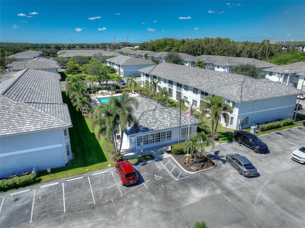 8358 Bernwood Cove Loop, Unit 708 Fort Myers, FL 33966 - Photo 8 of 32 a view of a patio with table and chairs potted plants