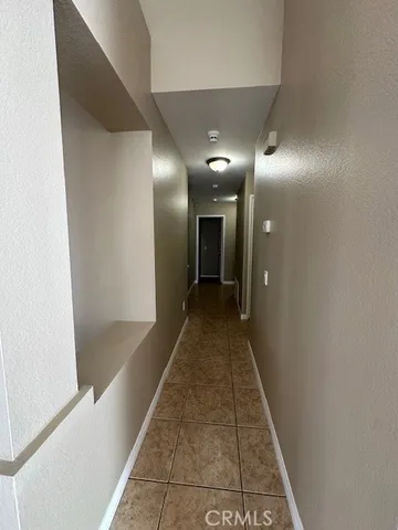a hallway with a sink